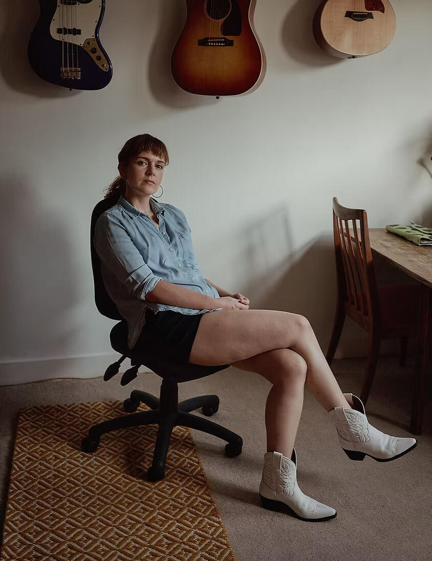 A photograph of Maletta Jackson sat in a chair